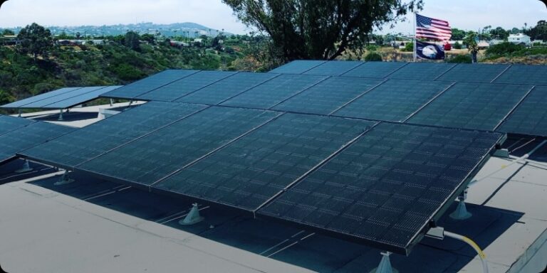 Solar panels installed on a building's roof, harnessing renewable energy for sustainable power generation.